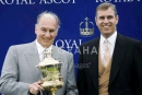 Prince Andrew The Duke of York presents the Prince of Wales Cup to Aga Khan, the owner of Azamour, the winning horse on the